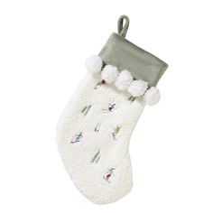 a white christmas stocking with snowmen and skis on it