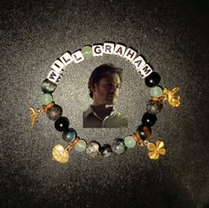 a bracelet with an image of a man in the middle and words that spell out, wild graham