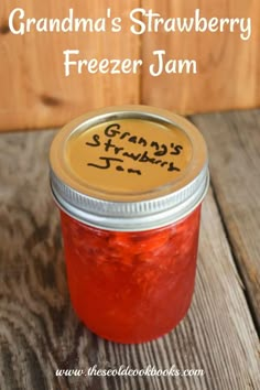 grandma's strawberry freezer jam in a jar with the words grandma's strawberry freezer jam written on it