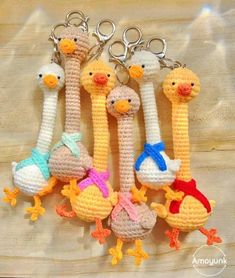 crocheted keychains with different types of ducks and chicks on them, all in various colors