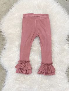 "The listing is for one pair of double ruffle leggings only. Choose color in drop down menu Our ruffle leggings run true to size to slightly generous. Size-inseam of leggings NB-6\" 0-3m-7\" 3-6m-8\" 6-9m- 9\" 9-12m-10.5\" 12-18m-11.5\" 18-24m-13\" 2-3t-14.5\" 3-4t-16\" 4-5y-17.5\" 5-6y-19\" 6-7y-20\" Please note: Due to variation in each computer monitor there may bel slight differences between the photo shown and the actual item." Stretch Bottoms With Ruffles In Solid Color, Fitted Cotton Bloomers With Ruffles, Cute Stretch Bottoms With Ruffles, Cute Ruffled Bottoms For Loungewear, Elastic Cotton Bottoms With Ruffles, Cute Ruffled Loungewear Bottoms, Elastic Cotton Ruffled Bottoms, Fall Ruffled Bottoms For Loungewear, Cute Fitted Bottoms With Ruffles