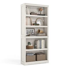 a white bookcase filled with lots of books and wicker baskets on top of it