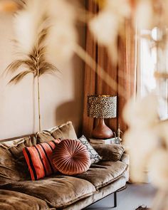 a living room filled with furniture and a lamp