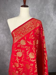 Red Color Dupatta with Floral Jaal design with red color tassles on both the ends of the dupatta. Perfect Gift !! Very Light Weight Item: DupattaBase color Red Fabric : Silk (Not Pure Silk)Work : Zari Weaved with tasselsLength of the Dupatta : 88 inches approx.Width of the dupatta : 33 inches (Approx.) Store Policies- No return or exchange will be accepted for color variations.- No return or exchange will be accepted if the color does not match your other clothing or your partners or anyone else.- Since this Dupatta is handmade hence little inconsistencies may be there however it is not considered as a defect.- Zari or thread coming out or on folds is not considered as defects.- Slight variation in actual color vs. image is possible due to the screen resolution. Color might look different Red Brocade Dupatta For Navratri, Red Brocade Traditional Wear With Dupatta, Red Brocade Dupatta With Zari Work, Red Brocade Dupatta With Traditional Drape, Red Self Design Dupatta For Puja, Red Brocade Dupatta For Festive Occasions, Red Jamawar Saree With Motifs, Red Semi-stitched Brocade Dupatta, Red Brocade Dupatta For Diwali