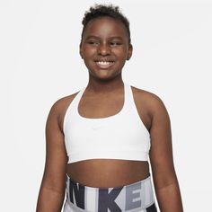 With a classic racerback design, the Nike Swoosh Sports Bra is more than just comfortable—it sends sweat packing. Our lightweight fabric moves sweat away from your body to help you stay dry, cool and focused, so you never have to sit a play out. Girls Sports Bras, Blusas T Shirts, Nikes Girl, Nike Sports Bra, Nike Swoosh, Nike Dri Fit, Big Kids, Lightweight Fabric, Shapewear