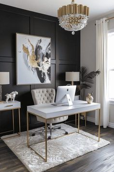 a living room with black walls, white furniture and a chandelier hanging from the ceiling