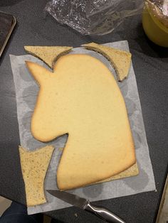 a piece of bread that has been cut into shapes and is sitting on a table