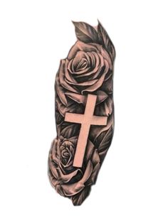 a cross with roses and leaves on it is in the shape of a hand tattoo