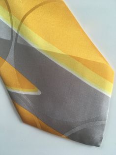 "Vintage necktie Montana. Made in Italy. 1980/1990s 100% silk Abstract pattern tie in yellow, grey and white color. Label on the back. Deadstock item in perfect condition. Measures: Overall length: 143cm - 56,2\" Width: 9,5cm - 3,7\" Please note that our vintage items are from time and may have minor imperfections. For more details, photos and item information, please send us a personal message." Claude Montana, Pucci Vintage, Yellow Grey, Silk Necktie, Gifts For My Boyfriend, Vintage Silk, Canvas Leather, Personal Message, Necktie