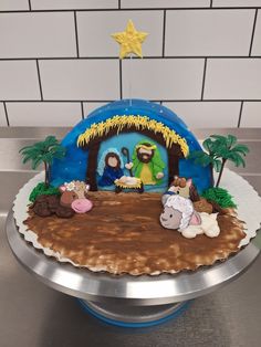 a cake that is decorated to look like a nativity scene