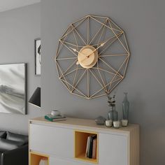 a living room with a clock on the wall and some vases in front of it