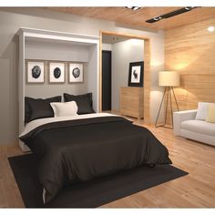 a bedroom with wood paneling and white furniture in the room, including a bed