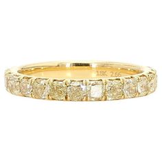 RareGemWorld's classic diamond eternity band. Mounted in a beautiful 18K Yellow Gold setting with natural radiant yellow diamond's. This band is guaranteed to impress and enhance your personal collection! Total Weight: 1.01cts Natural Radiant Yellow Diamonds 18K Yellow Gold Size 6 This ring is not sizable (special orders are available for a different price point depending on the size) All diamonds are guaranteed natural International Shipments: Please note that customers are responsible for all import duties and taxes applicable to the country of shipment Returns: Returns accepted in original format within 14 days of receipt Do not forget to view our entire inventory! Thank you for reviewing our item Yellow Diamond Eternity Band, Gold Eternity Band, Yellow Diamonds, Diamond Eternity Band, Yellow Gold Wedding Band, White Gold Set, Radiant Diamond, Yellow Gold Setting, Modern Ring