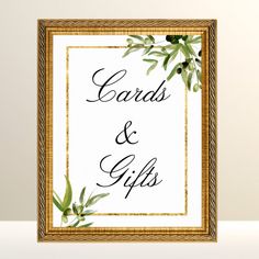 a sign that says cards and gifts in black ink on a white background with green leaves