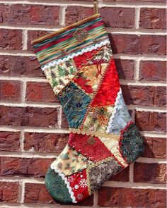 a christmas stocking hanging on a brick wall