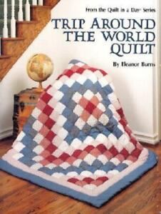 a book cover with a red, white and blue quilt on the floor next to a stair case