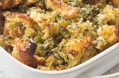 a casserole dish with bread and vegetables in it