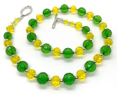 "Delicious Lightweight handcrafted 22\" necklace punches up any outfit.  Acrylic beadwork accents your wardrobe with creativity and color. This sparkly lemon-lime  light-hearted necklace is both classic and contemporary. A breath of spring any time of the year!  Refresh that outfit and make it new again!" Spring Yellow Round Jewelry, Handmade Green Beaded Necklace For Spring, Party Green Necklaces With Lobster Clasp, Green Necklaces With Lobster Clasp For Party, Handmade Neon Yellow Jewelry For Summer, Green Round Bead Jewelry For Spring, Green Necklaces For Summer Parties, Green Round Beads Jewelry For Summer, Summer Green Jewelry With Round Beads