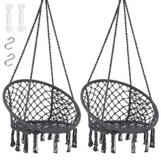 two black hanging chairs with tassels attached to the back and one in front