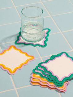 The Teatime Scalloped Coaster Set is so cute! With a wavy edge and on-trend colors, you'll set your table in style with these hand-printed coasters. Made with thick, absorbent blotter paper intended to withstand everyday use. Should any warping occur, simply dampen the coaster and flatten it under a heavy object. Set of 8 Letterpress Printed Coasters in an Acrylic Keepsake Box Each Set Contains 2 Designs Ceramic Coaster Ideas, Wavy Decor, Clay Coasters Diy, Diy Clay Coasters, Funky Coasters, Coaster Design Ideas, Coasters Painting, Air Dry Clay Coasters, Aesthetic Coasters