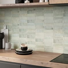 a kitchen counter with a coffee cup on it