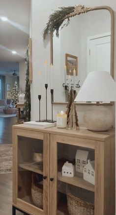 a living room filled with furniture and a large mirror