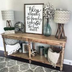 a wooden shelf with some vases on top of it and a sign above it