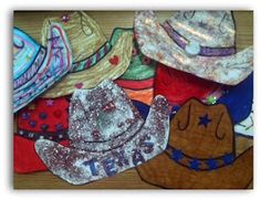 many different hats are laying on the floor together, including one with sequins