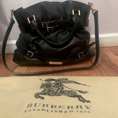 Black Burberry Bag With Beautiful Gold Hardware. Barely Worn, Spacious Goes Great With Any Look. Burberry Bags Handbags Black, Burberry Bag, Womens Tote Bags, Gold Hardware, Burberry, Prada, Top Handle Bag, Gold, Black