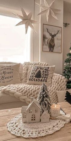 a living room with a christmas tree and decorations