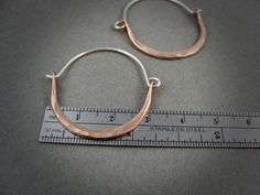 "These delicate 14k rose gold filled hoops have been hand formed and connect to a hammered sterling silver ear wires. The metal has been hammered to be wider at the bottom and given a gentle curve. Unique, simple and perfect for everyday. Size ~ Approximately 1 1/8\" X 1 1/2\" ☞ Each pair is made by hand, expect slight variation. Be sure to check out my shop to find more size and color options. https://www.etsy.com/shop/sirenjewels ★ Shipping ~ Domestic orders are sent USPS first class and a tra Hammered Rose Gold Sterling Silver Hoop Earrings, Minimalist Hammered Copper Jewelry, Rose Gold Hammered Sterling Silver Hoop Earrings, Gemstone Hoop Earrings, Gold Filled Hoops, Hammered Sterling Silver, Hammered Gold, Moonstone Pendant, Gold Art