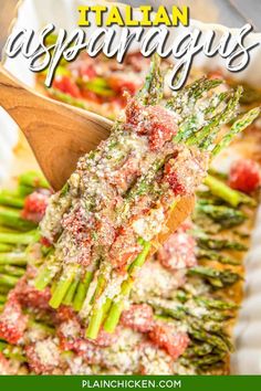 asparagus with parmesan cheese and sauce in a white dish on a wooden spoon