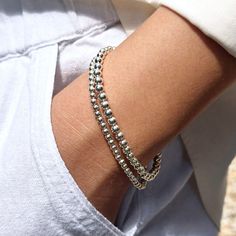 Stacked Bracelets With Round Beads, Silver Trendy Layering Bracelets, Trendy Silver Bracelets For Layering, Silver Stackable Beaded Bracelets For Everyday, Adjustable Silver Tennis Bracelet For Everyday, Silver Minimalist Wrap Bracelet, Dainty Silver Stackable Stretch Bracelet, Flexible Everyday Bracelets, Trendy Silver Wrap Bracelet As Gift