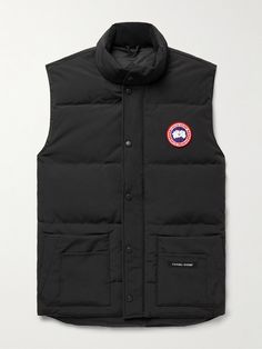 Canada Goose updates its popular 'Freestyle' gilet with a slimmer cut in this 'Crew' version. Designed for lightweight warmth, it's made from durable, water and wind-resistant Arctic Tech and quilted to keep the insulating down fill evenly distributed around your core. The stand collar is lined in soft microfibre for comfort, while six front pockets and two inside provide plenty of storage. Canada Goose Mens, Sleeveless Coat, Outdoor Jacket, Loungewear Shorts, Warm Coat, Mr Porter, Canada Goose, Canada Goose Jackets, Stand Collar