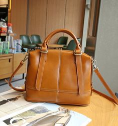 MATERIAL - Made of 100% high quality vegetable-tanned leather, solid color,feels cosy to touch,delicate, durable. The hardware parts are made of cast molding thick hardware, top metal hardware. The stitching is well-made, firm and smooth.DIMENSIONS - 12.6L*5.5W*9.1H(inch) / 32L*14W*23H(cm).STRUCTURE - This handbag contains 2 main compartments, 1 inner slip pocket, 2 inner zipper pockets, 1 back zipper pocket. Comfortably holds mobile phone, cosmetics, keys, charge, essentials and so on.FUNCTIONA Leather Shoulder Bag With Adjustable Double Handle, Leather Shoulder Bag With Adjustable Strap And Double Handle, Leather Bags With Adjustable Strap And Double Handle, Leather Bag With Adjustable Strap And Double Handle, Office Leather Hobo Bag, Classic Handheld Bucket Bag For Office, Classic Handheld Bucket Bag For Travel, Leather Satchel Shoulder Bag, Leather Bucket Shoulder Bag For Office