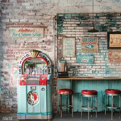 Retro Ice Cream Parlor Photography Backdrop Description The Retro Ice Cream Parlor Photography Backdrop is designed to transport your photoshoots back to the 1950s, offering a visually rich setting filled with nostalgia. With its weathered brick walls, retro signage, and a vibrant jukebox, this backdrop is perfect for creating fun, vintage-inspired imagery. Ideal for family portraits, fashion shoots, or commercial product photography, this backdrop captures the charm of a classic American ice cream shop. The backdrop’s combination of teal, red, and cream accents, alongside distressed textures, make it perfect for both personal and professional use. Key Features General Description: A vintage ice cream parlor scene featuring a jukebox, retro signs, and bar stools, perfect for nostalgic, 50s Vintage Ice Cream Parlor, Retro Ice Cream, Commercial Product Photography, Retro Signage, Retro Signs, Vintage Bakery, Soda Shop, Fashion Shoots, Vintage Ice Cream