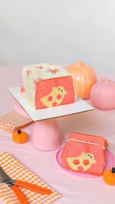 there is a piece of cake on the table with other items around it and pumpkins in the background