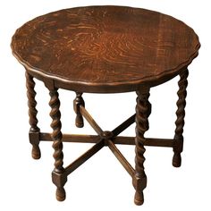 a small wooden table with two legs and a round top on an isolated white background