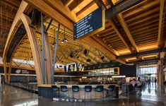 the inside of an airport with people walking around