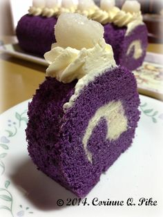 two pieces of purple cake with white frosting