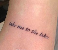 a tattoo saying take me to the lake