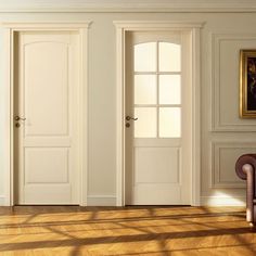 an empty room with two doors and a chair in the corner on the hardwood floor