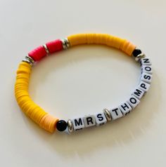 Back to School!  If you are a teacher or have a special teacher in your life, this bracelet is a must! It will make an amazing personalized gift that any teacher would appreciate!  Completely customized. Color of the pencil can be yellow, blue, or green.  Men's Bracelet Standard Size 8 inches Women's Bracelet Standard Size 7 inches Beads will be strung on a clear elastic so it can stretch to fit most wrists, but if you need a larger or smaller size please let me know.  Please send the teacher's name or inscription when ordering as well as the size and color that you would like! Since all orders are made at the time or purchase, please allow for processing time in addition to shipping time. Personalized Yellow Stretch Bracelet As Gift, Personalized Yellow Beaded Bracelets For Gifts, Personalized Yellow Beaded Bracelets As Gift, Personalized Yellow Beaded Bracelet As Gift, Personalized Yellow Beaded Bracelet Gift, Personalized Multicolor Bracelets For School, Customizable Adjustable Jewelry For School, Personalized Adjustable Yellow Beaded Bracelets, Personalized Adjustable Bracelets For Teacher Appreciation