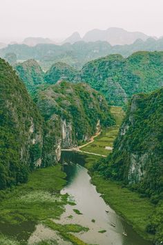 a river running through a lush green valley