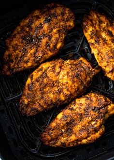 some chicken is cooking on the grill and it looks like they're going to cook