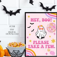 there is a sign that says hey, boo please take a few with some candy in front of it