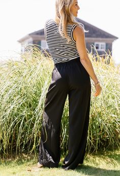 Style & Details: Step up your office outfit game with the Land's End Pants. Featuring a smocked waistband, belt loops, and pockets, these pleated dress pants offer both style and function. True to size. Size & Fit: Model is wearing a size smallModel Height: 5’7Waist: 27inHips: 35inBust: 34inBased on size small14" across waist12" rise42" length Fabric & Care 95% Polyester 5% Spandex Hand Wash Cold Line Dry ITEM#: PK7896 Shipping Free Shipping when you spend $100 or more! Orders below $100 will be Casual Paperbag Waist Bottoms For Business Casual, Fall Black Bottoms With Pleated Waist, Black Dress Pants With Loosely Fitted Hips For Spring, Black Dress Pants Loosely Fitted For Spring, Black Pull-on Style Wide Leg Pants For Summer, Black Summer Bottoms With Banded Waist, Summer Business Casual Paperbag Waist Pants, Casual High-waist Pants With Pleated Waist, Casual High Waist Pants With Pleated Waist