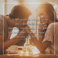 a man and woman sitting at a table in front of a coffee cup with the caption life has given us a happy home, and a wonderful family