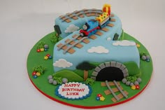 a birthday cake with a thomas the train theme