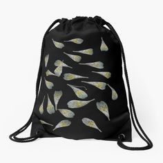 a black drawsack bag with yellow leaves printed on the front and back, hanging from a string